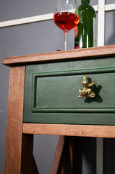 Green wooden drawer with a gold frog handle/ knob