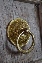 door knocker on a wooden door