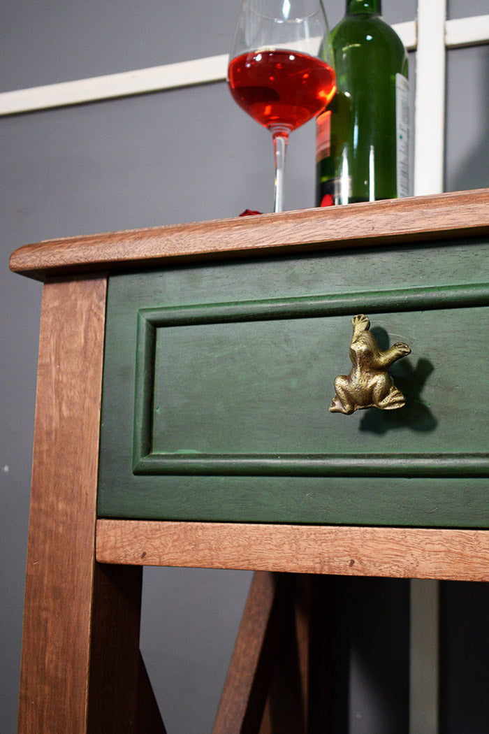 Green wooden drawer with a gold frog handle/ knob 