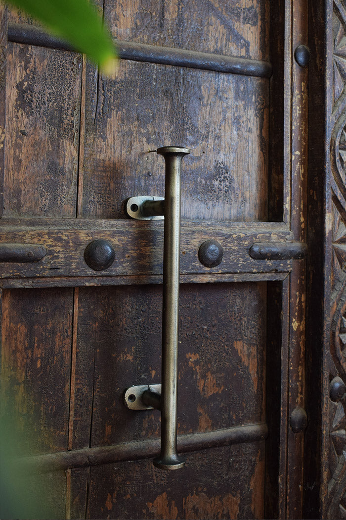 rustic wooden door with metal handle and lock